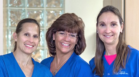 Three nurses smiling
