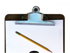 A paper board with a pencil