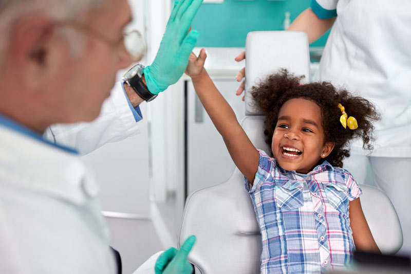 dentist with child patient in Amherst, NH